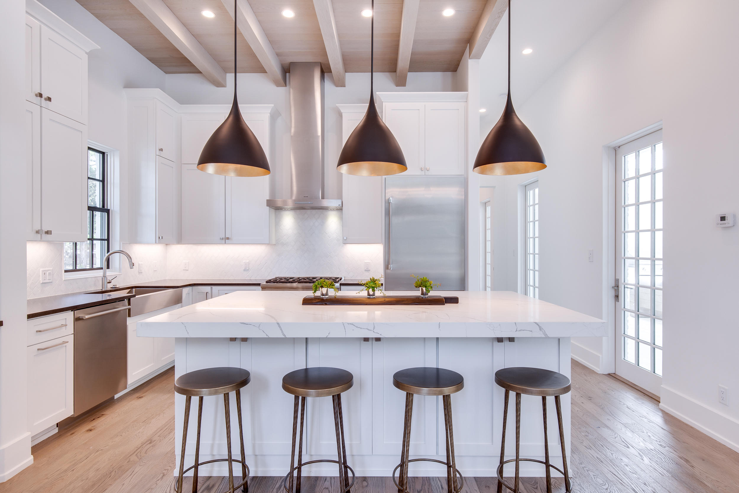79 Perrin, Unit LOT 54 Santa Rosa Beach, FL 32459 - Photo 11 of 36 a kitchen with a table chairs sink and cabinets