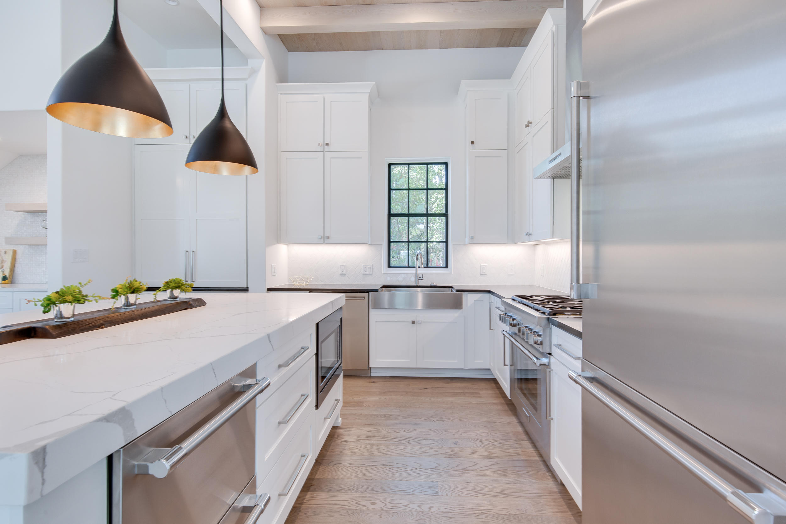 79 Perrin, Unit LOT 54 Santa Rosa Beach, FL 32459 - Photo 12 of 36 a kitchen with a sink stove and refrigerator