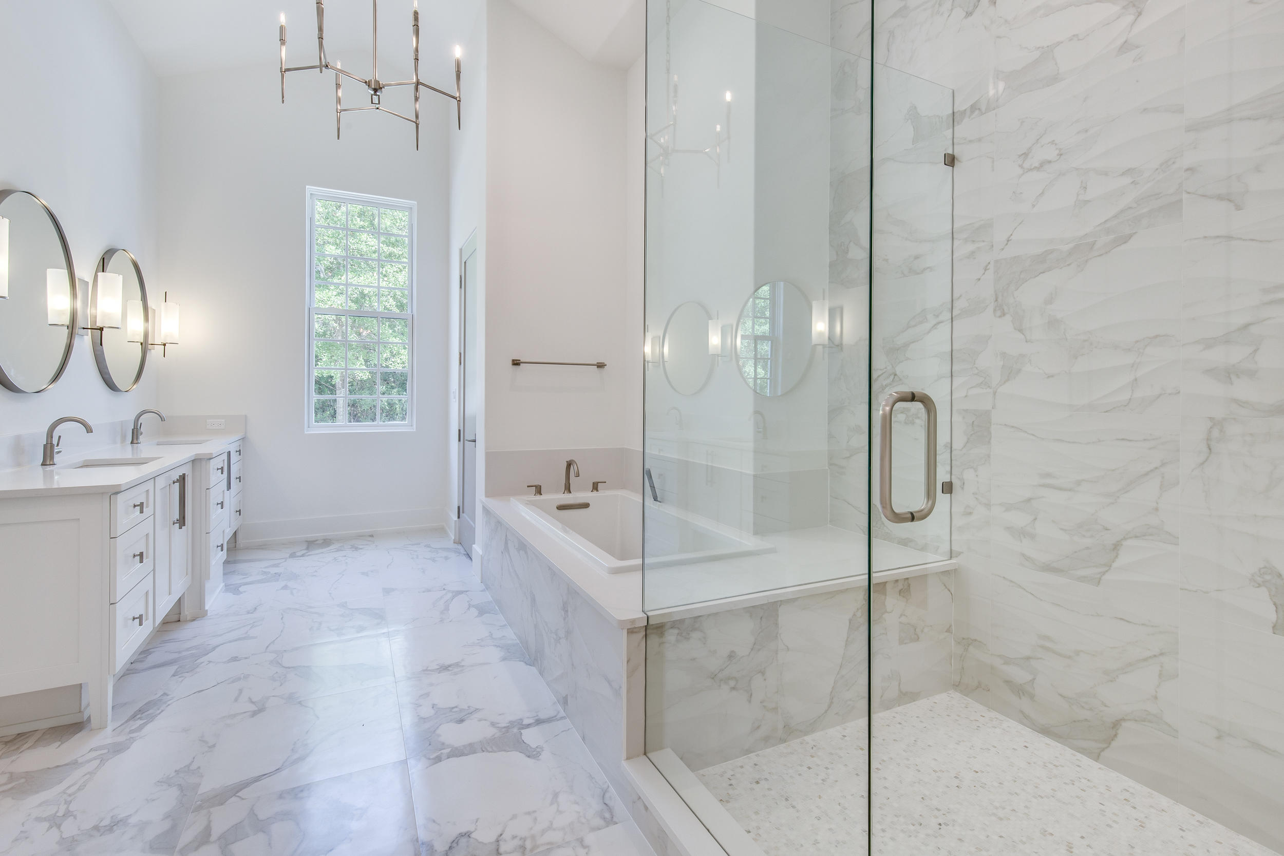 79 Perrin, Unit LOT 54 Santa Rosa Beach, FL 32459 - Photo 13 of 36 a bathroom with a double vanity sink a mirror and a shower