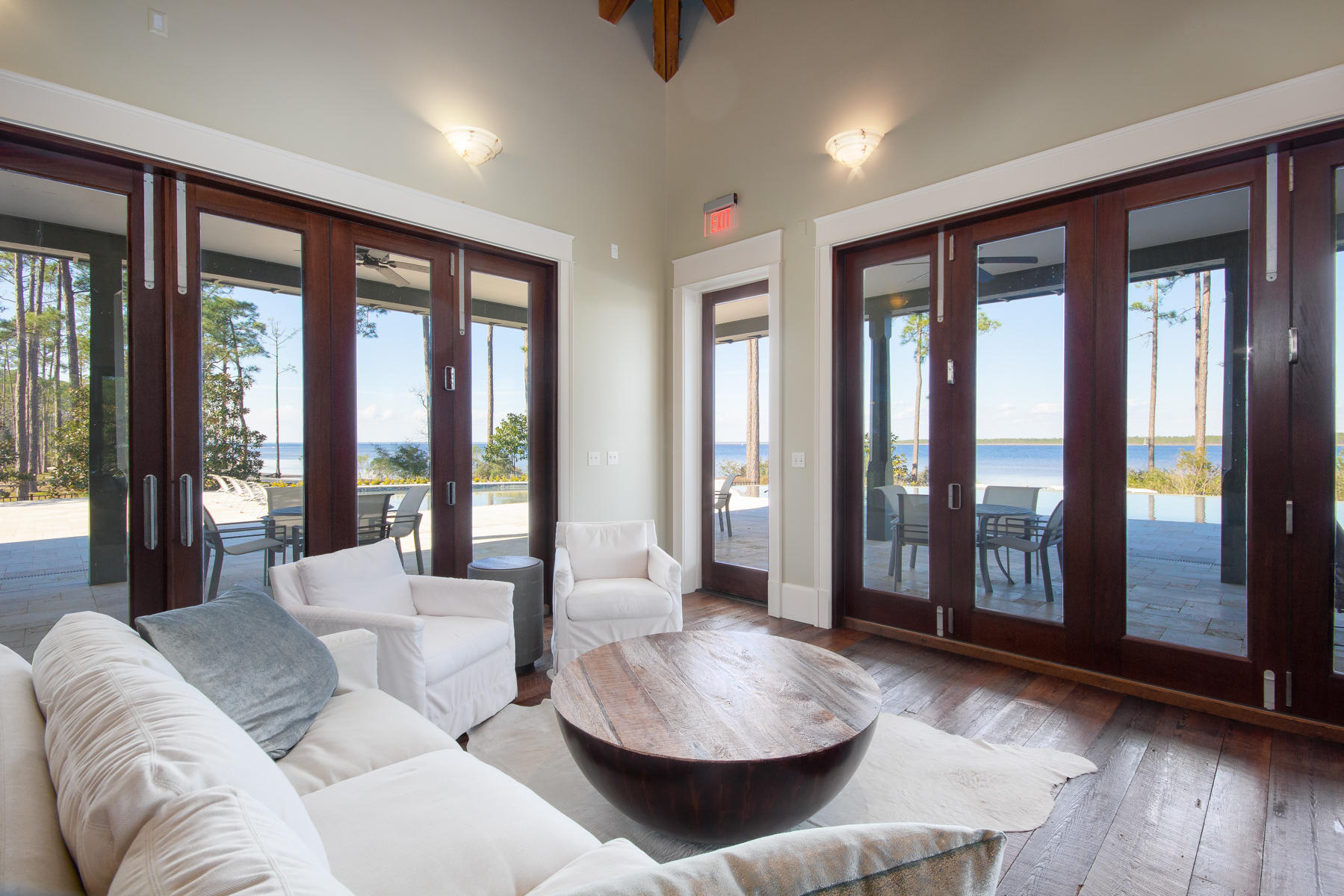 79 Perrin, Unit LOT 54 Santa Rosa Beach, FL 32459 - Photo 24 of 36 a living room with furniture and large windows