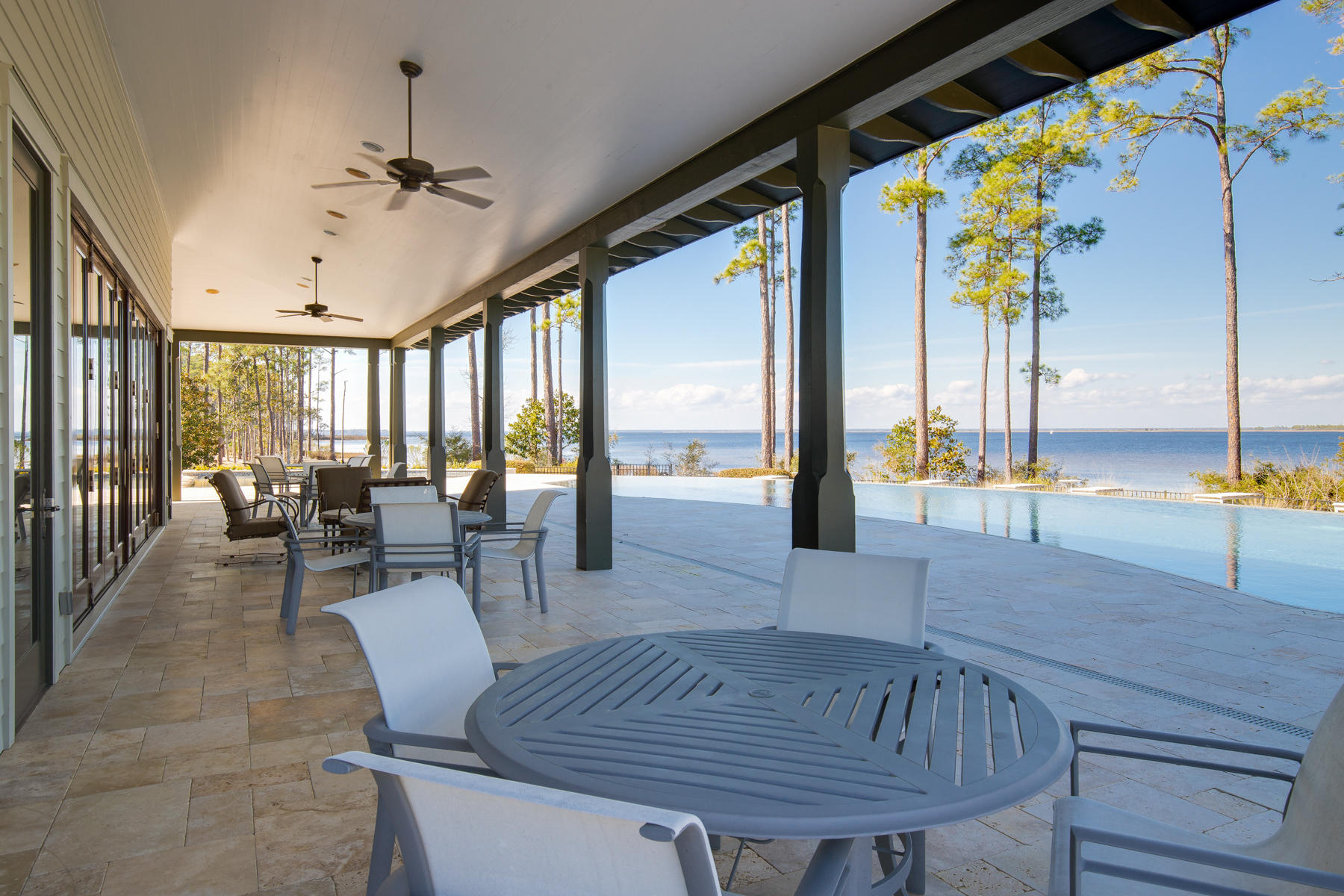 79 Perrin, Unit LOT 54 Santa Rosa Beach, FL 32459 - Photo 29 of 36 a view of a dining room and livingroom with furniture wooden floor a chandelier
