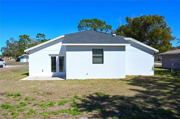 a backyard of a house with lots of green space