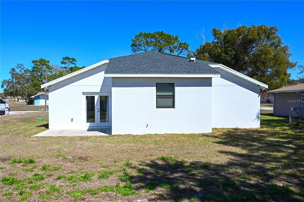 8452 Dorsey Street Spring Hill, FL 34608 - Photo 21 of 28 a view of a house with a yard