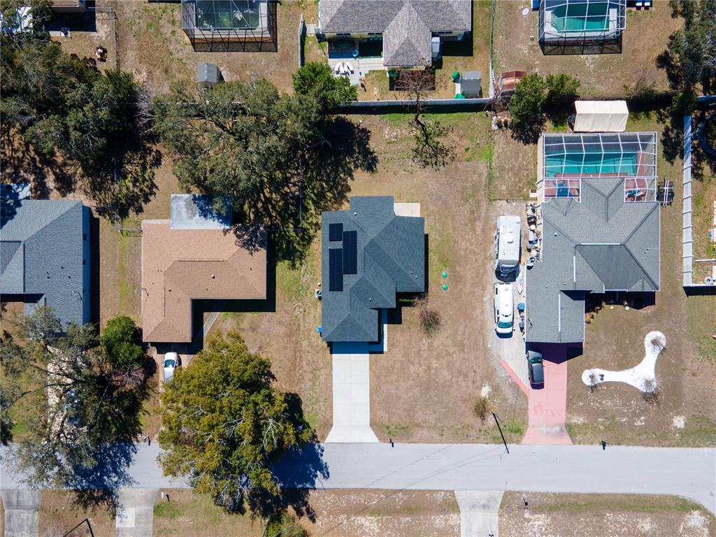 8452 Dorsey Street Spring Hill, FL 34608 - Photo 28 of 28 an aerial view of residential houses with outdoor space and parking