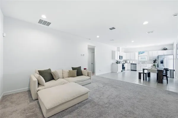 a living room with furniture and a table