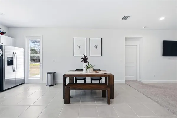 a view of a livingroom with furniture and a potted plant