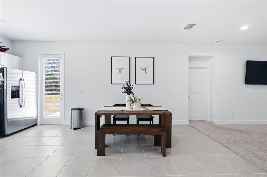 8452 Dorsey Street Spring Hill, FL 34608 - Photo 6 of 28 a view of a livingroom with furniture and a potted plant