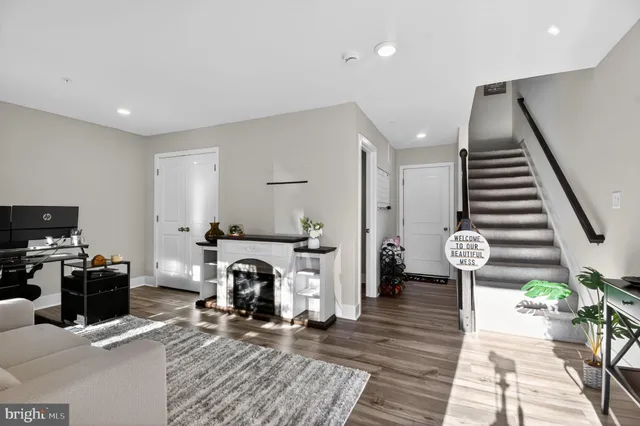 a living room with furniture and a fireplace