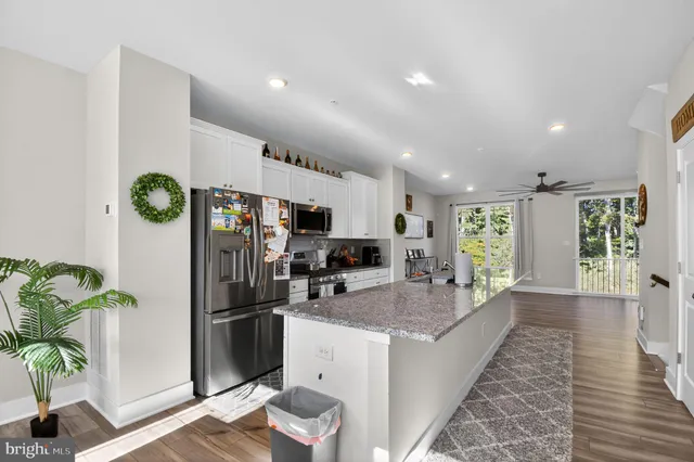 a view of a kitchen with refrigerator and outdoor