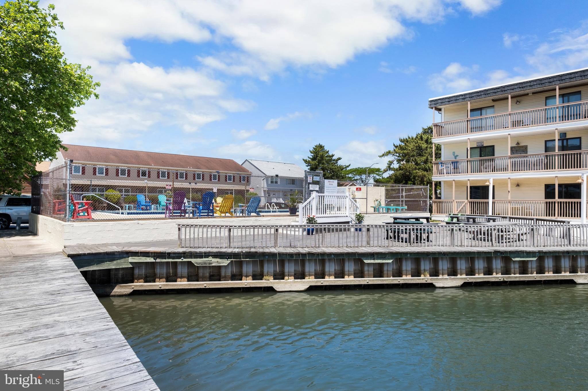 170 Captains Quarters Road, Unit 201 Ocean City, MD 21842 - Photo 13 of 65 a view of building with lake and windows