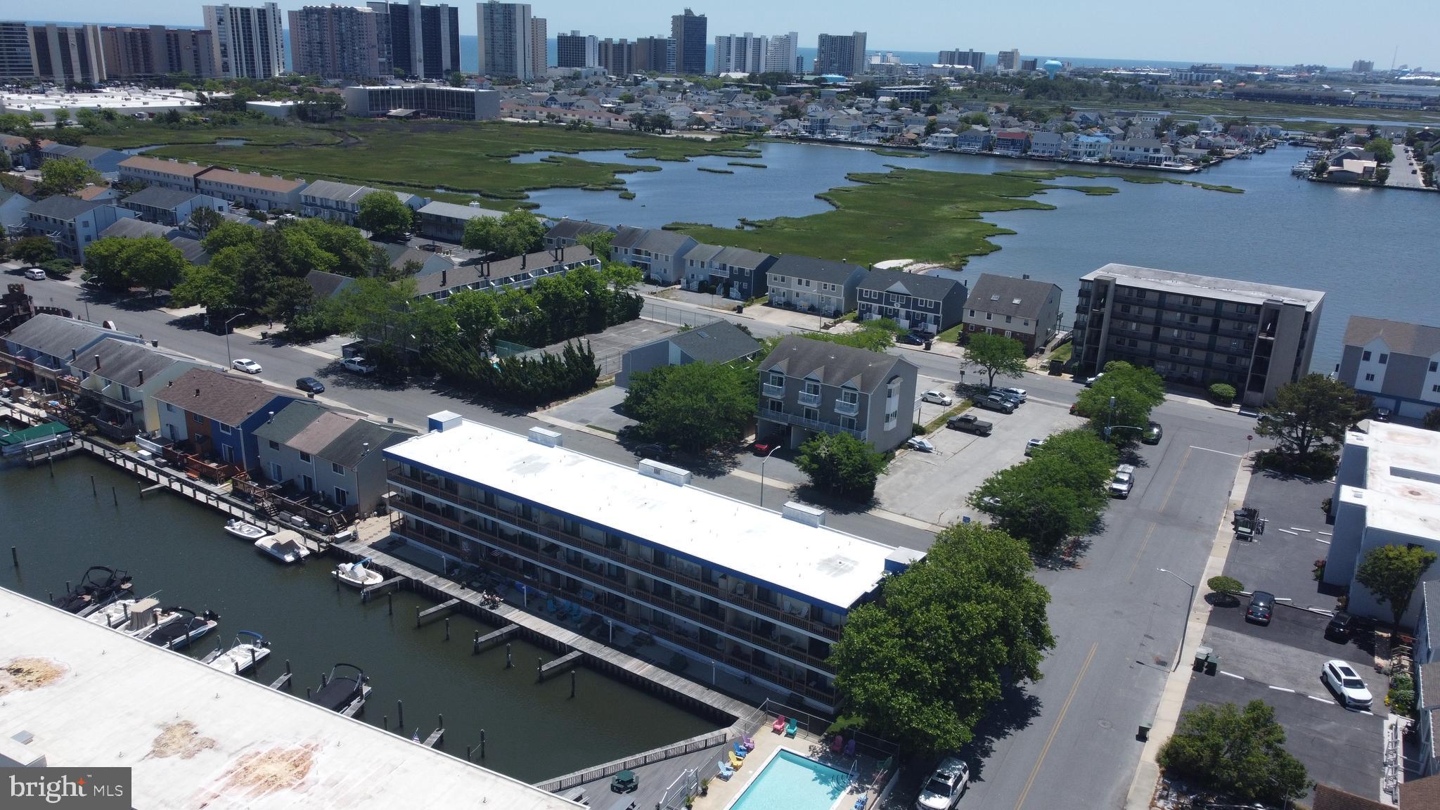 170 Captains Quarters Road, Unit 201 Ocean City, MD 21842 - Photo 24 of 65 an aerial view of house with yard and lake view