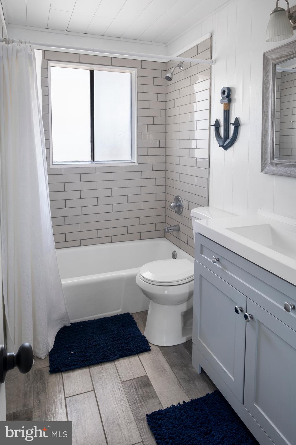 170 Captains Quarters Road, Unit 201 Ocean City, MD 21842 - Photo 25 of 65 a bathroom with a toilet a sink and bathtub
