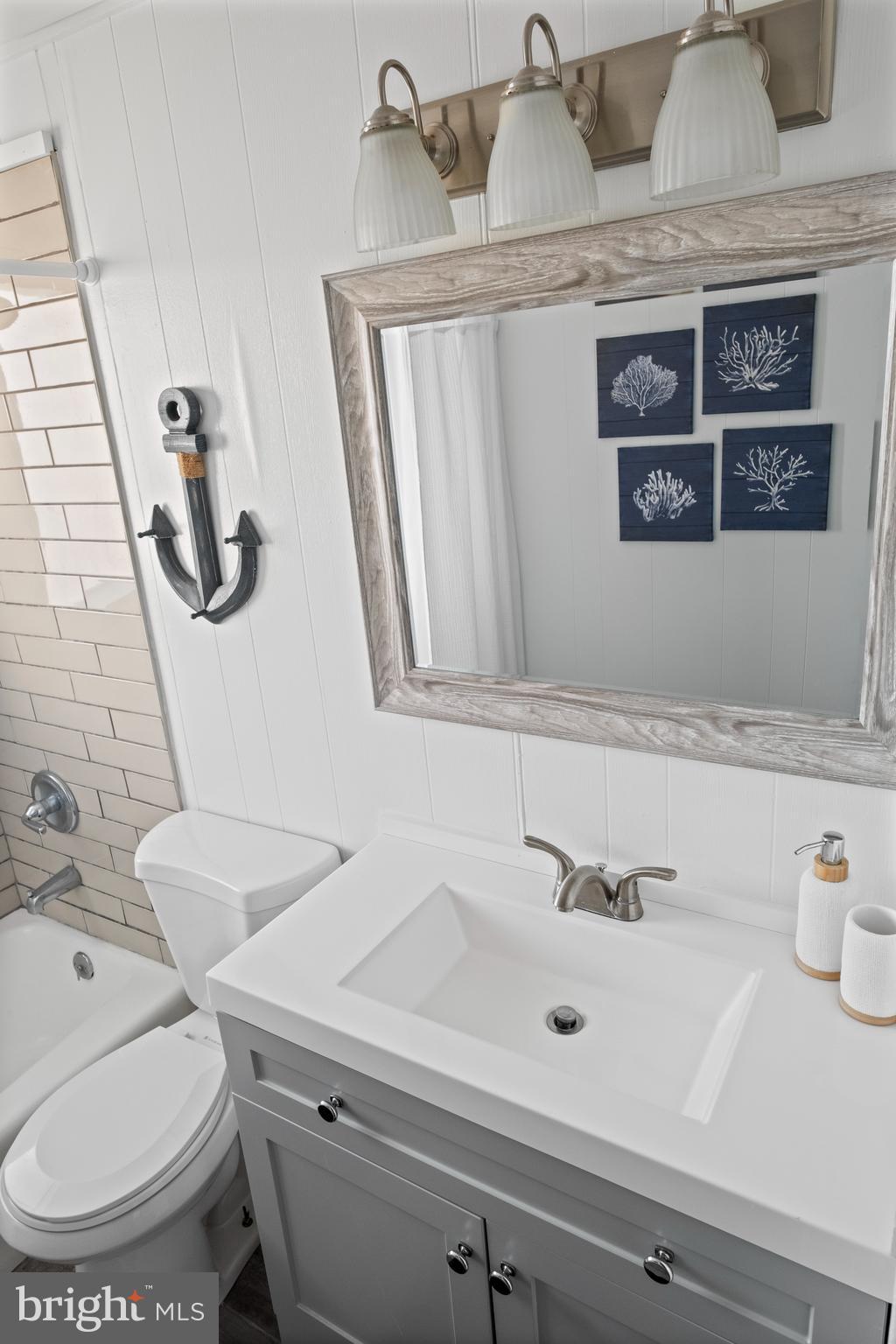 170 Captains Quarters Road, Unit 201 Ocean City, MD 21842 - Photo 27 of 65 a bathroom with a sink and a toilet