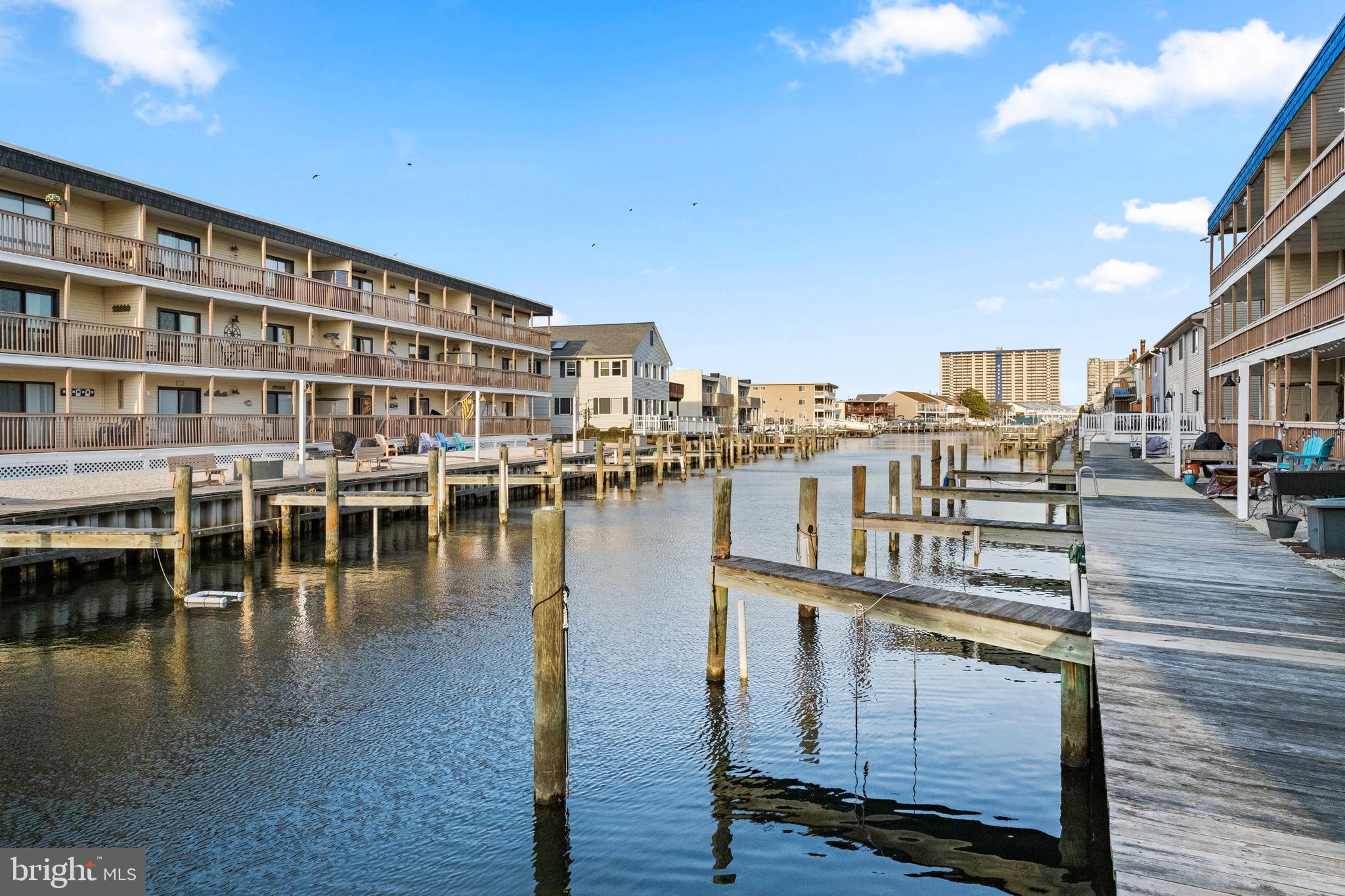 170 Captains Quarters Road, Unit 201 Ocean City, MD 21842 - Photo 28 of 65 a view of a lake with building in front of it
