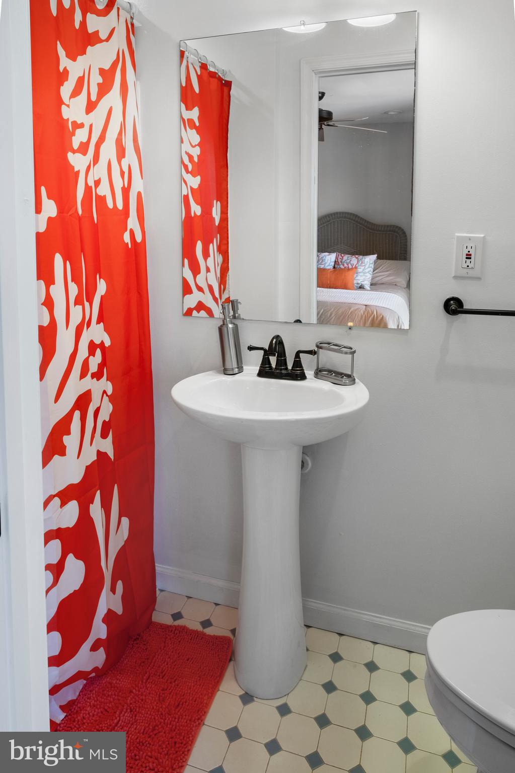 170 Captains Quarters Road, Unit 201 Ocean City, MD 21842 - Photo 32 of 65 a bathroom with a sink and a mirror