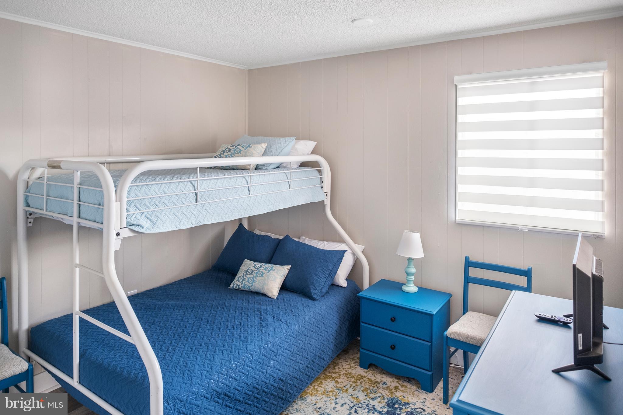 170 Captains Quarters Road, Unit 201 Ocean City, MD 21842 - Photo 47 of 65 a living room with furniture and a window
