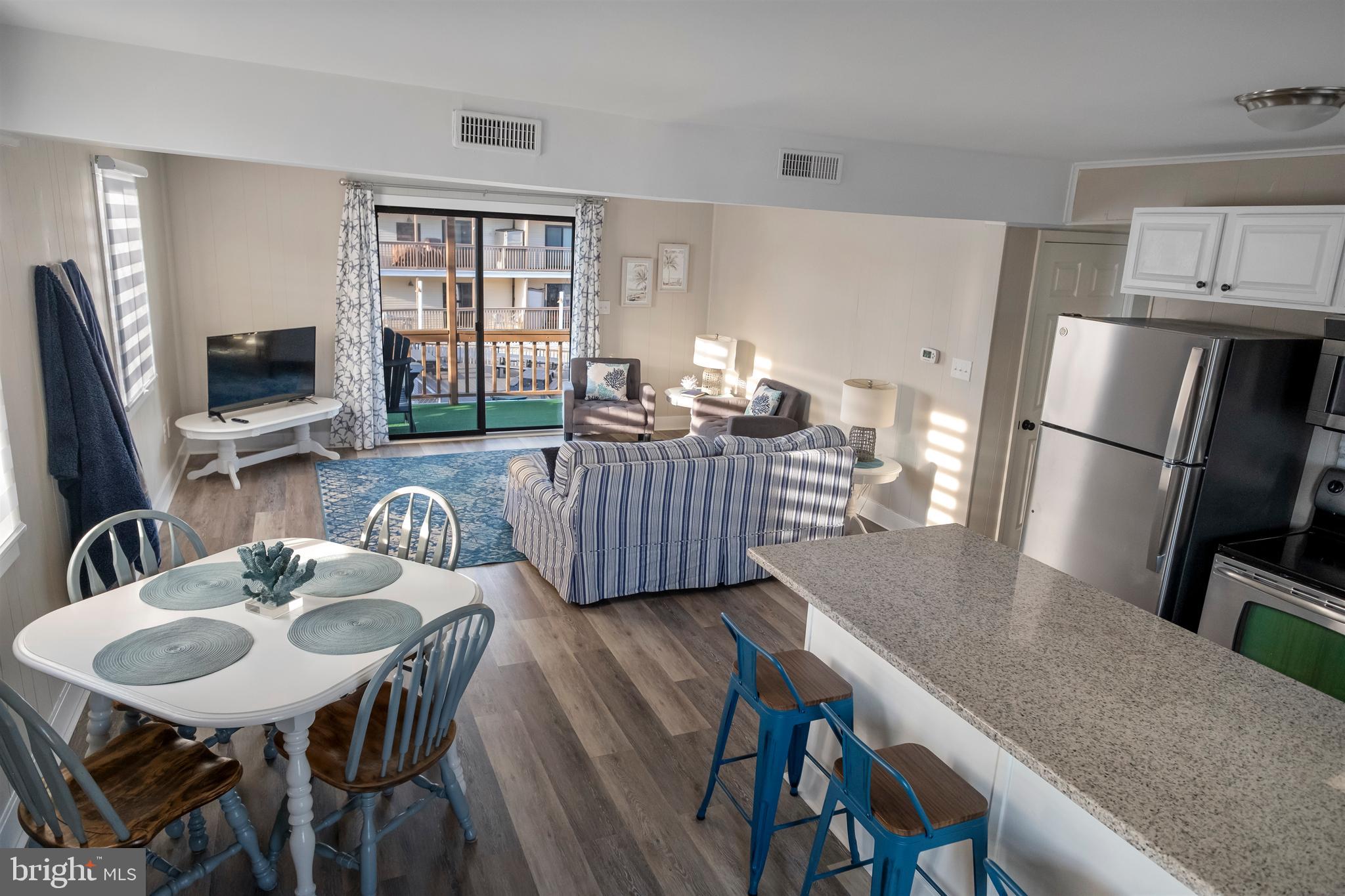 170 Captains Quarters Road, Unit 201 Ocean City, MD 21842 - Photo 50 of 65 a view of a dining room with furniture window and outside view