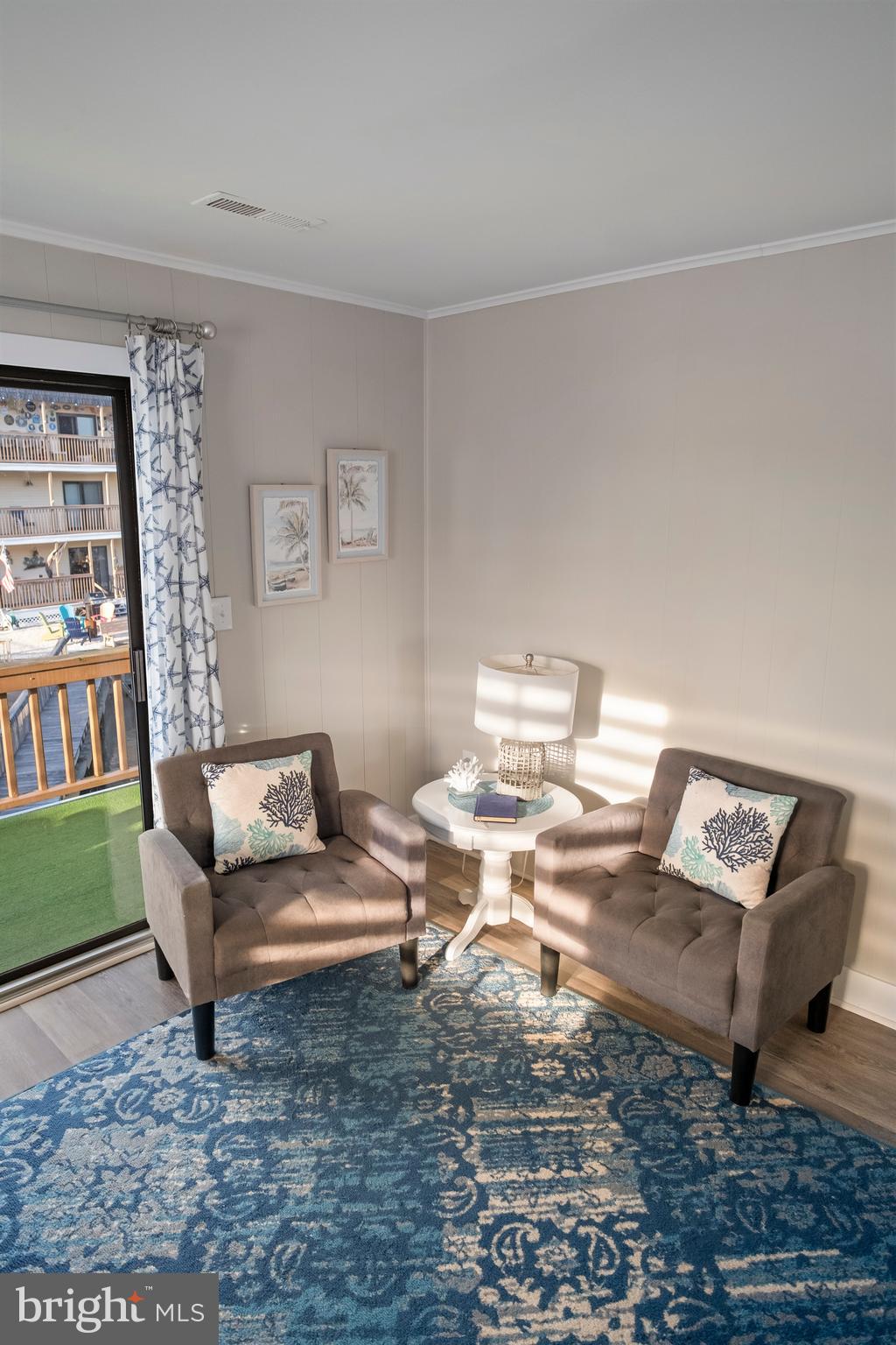 170 Captains Quarters Road, Unit 201 Ocean City, MD 21842 - Photo 58 of 65 a living room with furniture and a rug
