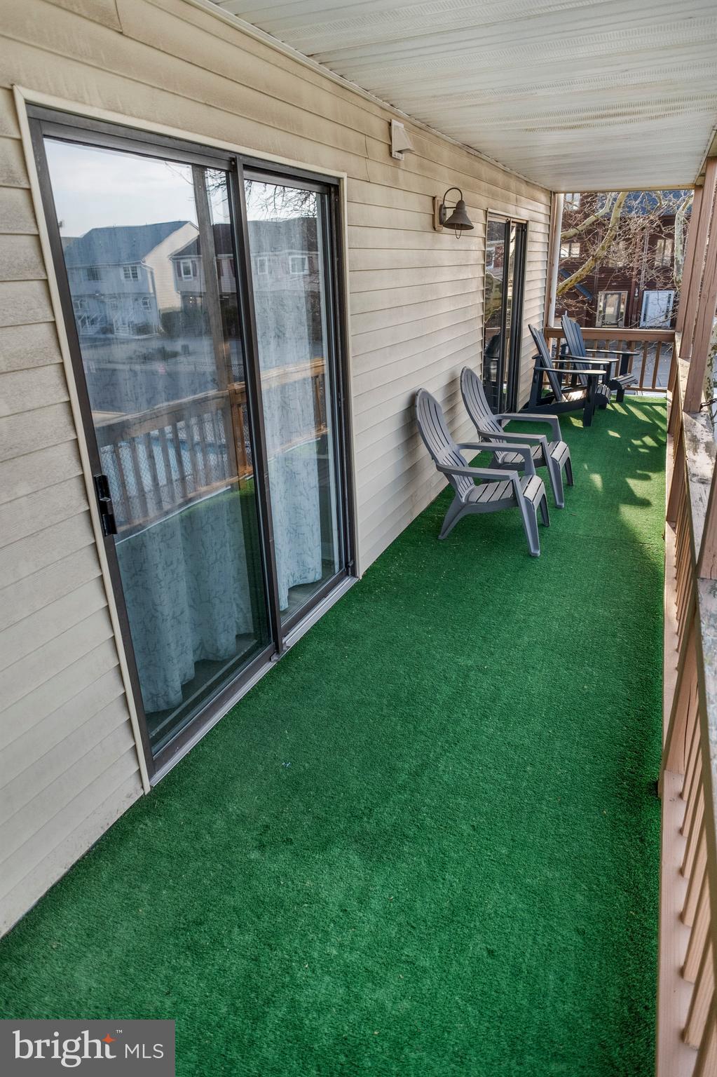 170 Captains Quarters Road, Unit 201 Ocean City, MD 21842 - Photo 61 of 65 a view of backyard with outdoor seating and hardwood