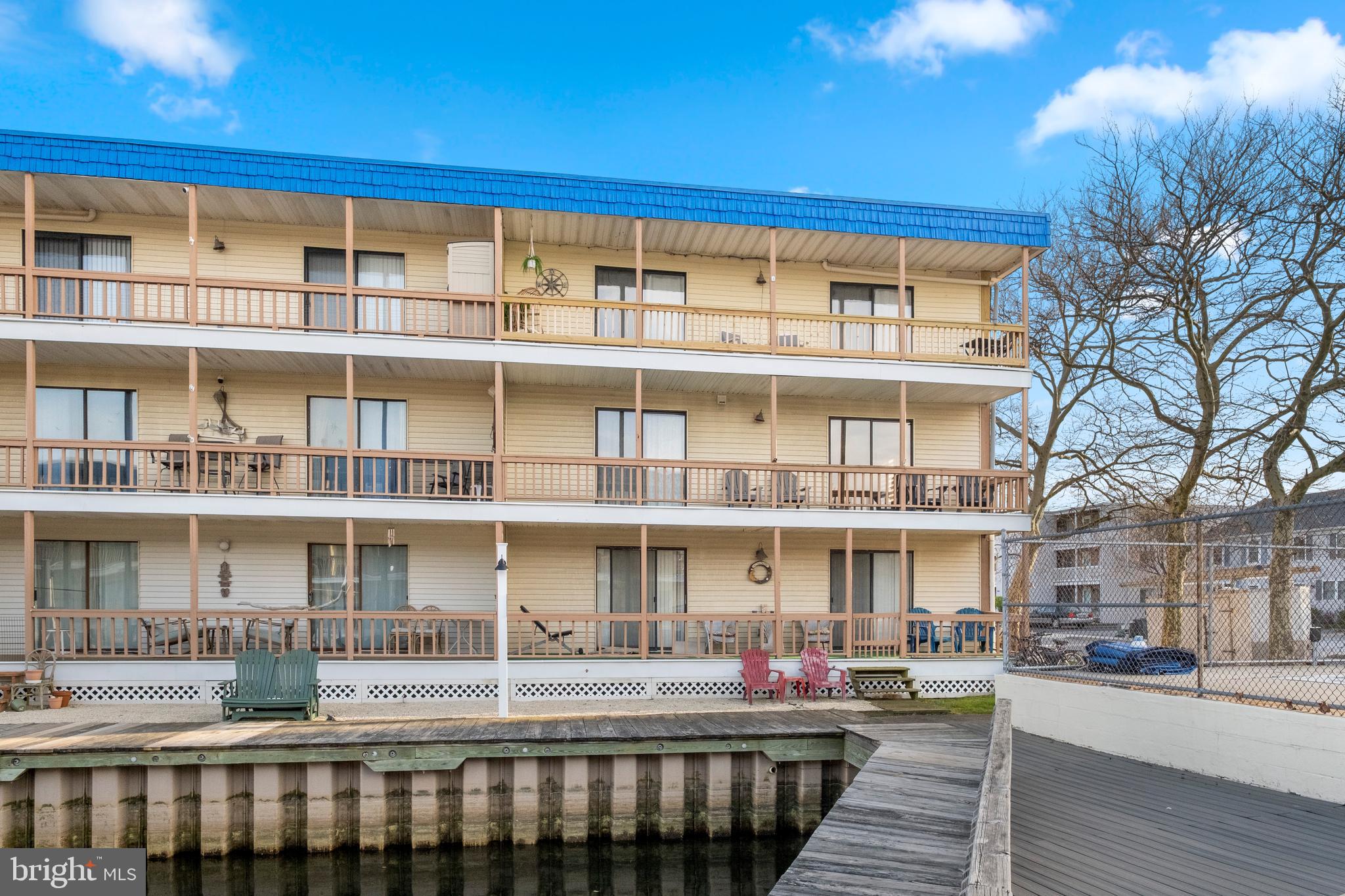 170 Captains Quarters Road, Unit 201 Ocean City, MD 21842 - Photo 62 of 65 a front view of a building with street view