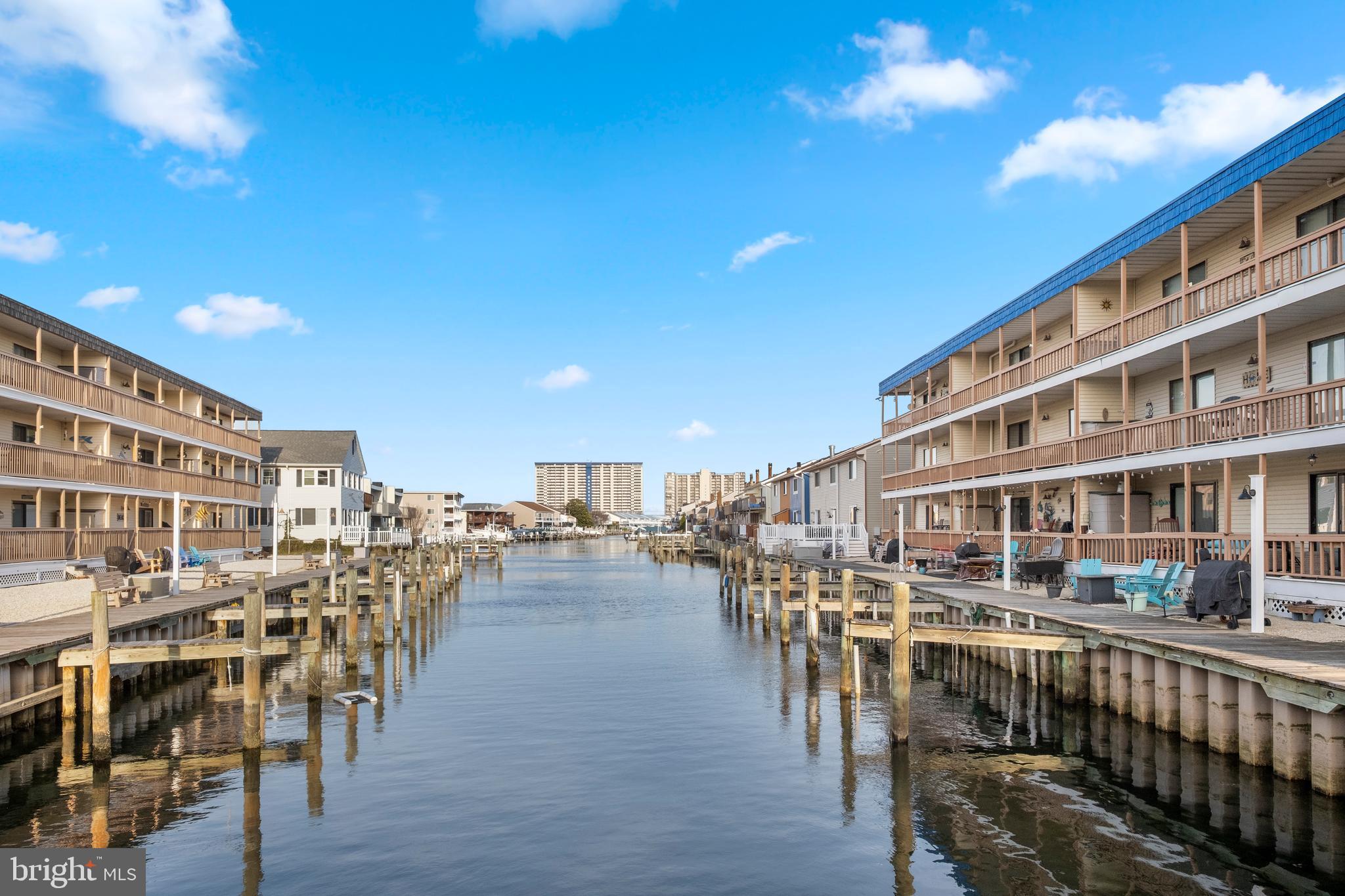 170 Captains Quarters Road, Unit 201 Ocean City, MD 21842 - Photo 63 of 65 a view of a swimming pool with outdoor seating