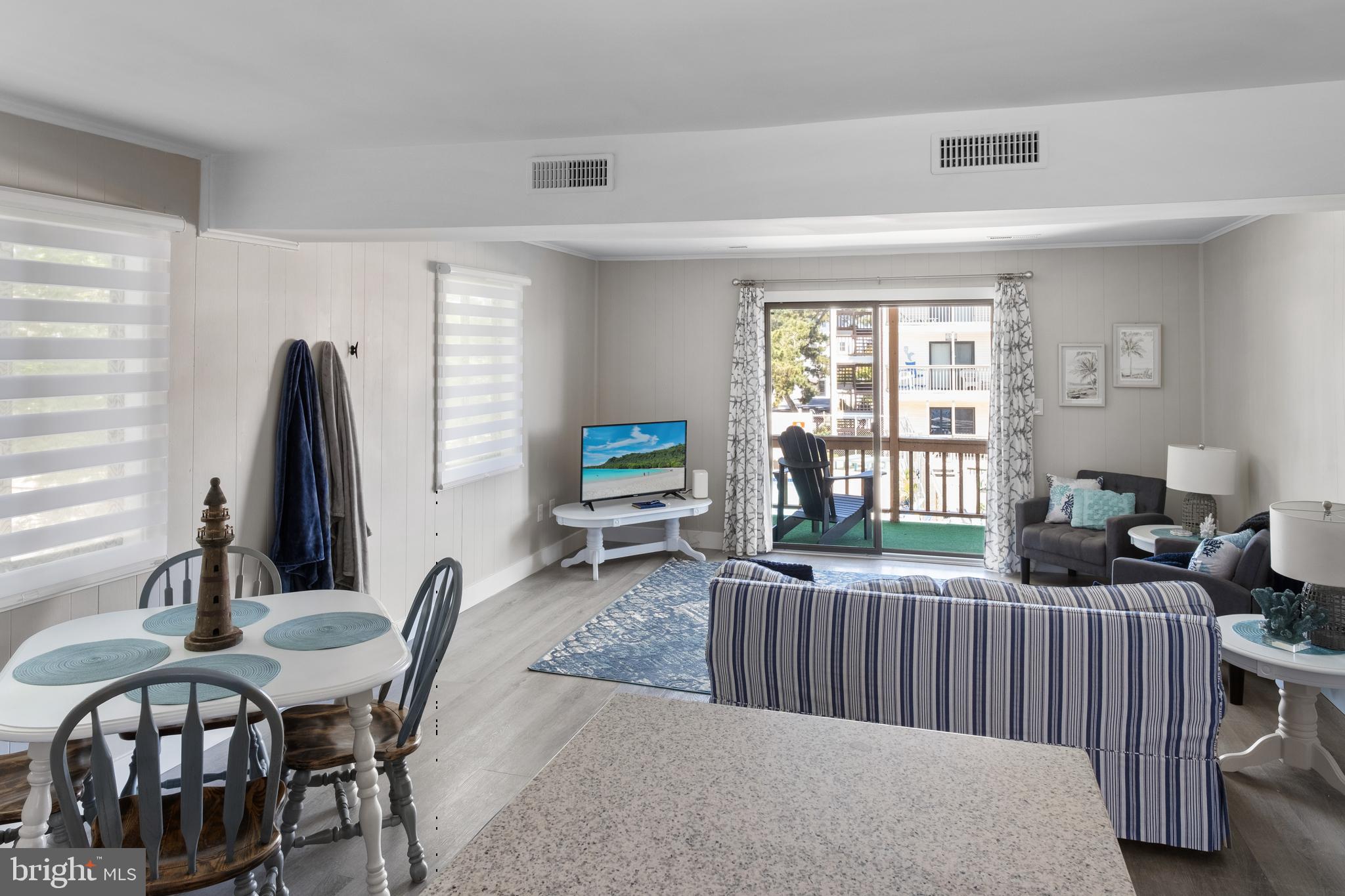 170 Captains Quarters Road, Unit 201 Ocean City, MD 21842 - Photo 10 of 65 a living room with furniture tv and a window