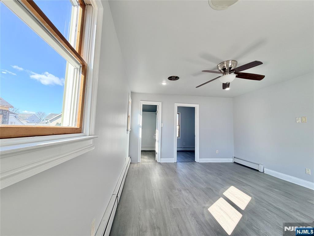 227 Washington Avenue Hackensack, NJ 07601 - Photo 20 of 33 a view of empty room with wooden floor and fan
