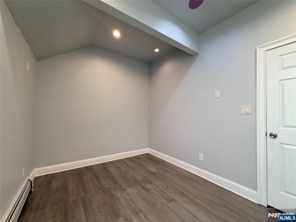 227 Washington Avenue Hackensack, NJ 07601 - Photo 22 of 33 a view of an empty room with wooden floor