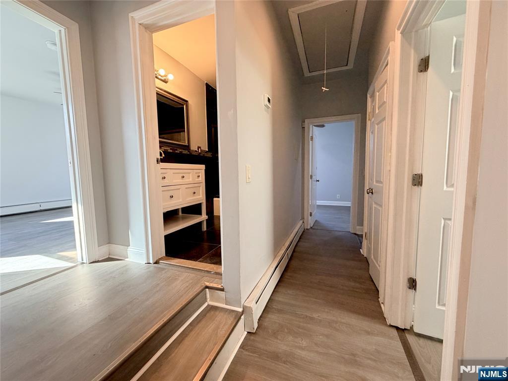 227 Washington Avenue Hackensack, NJ 07601 - Photo 23 of 33 a view of a hallway with wooden floor and staircase