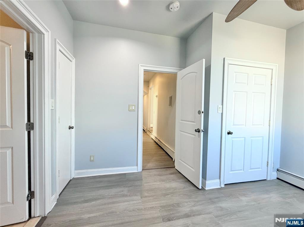227 Washington Avenue Hackensack, NJ 07601 - Photo 25 of 33 a view of an empty room with wooden floor