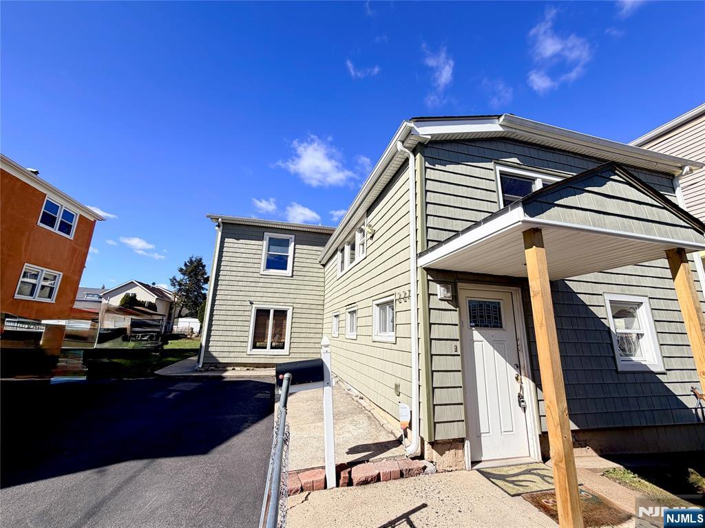227 Washington Avenue Hackensack, NJ 07601 - Photo 3 of 33 a front view of a house with parking