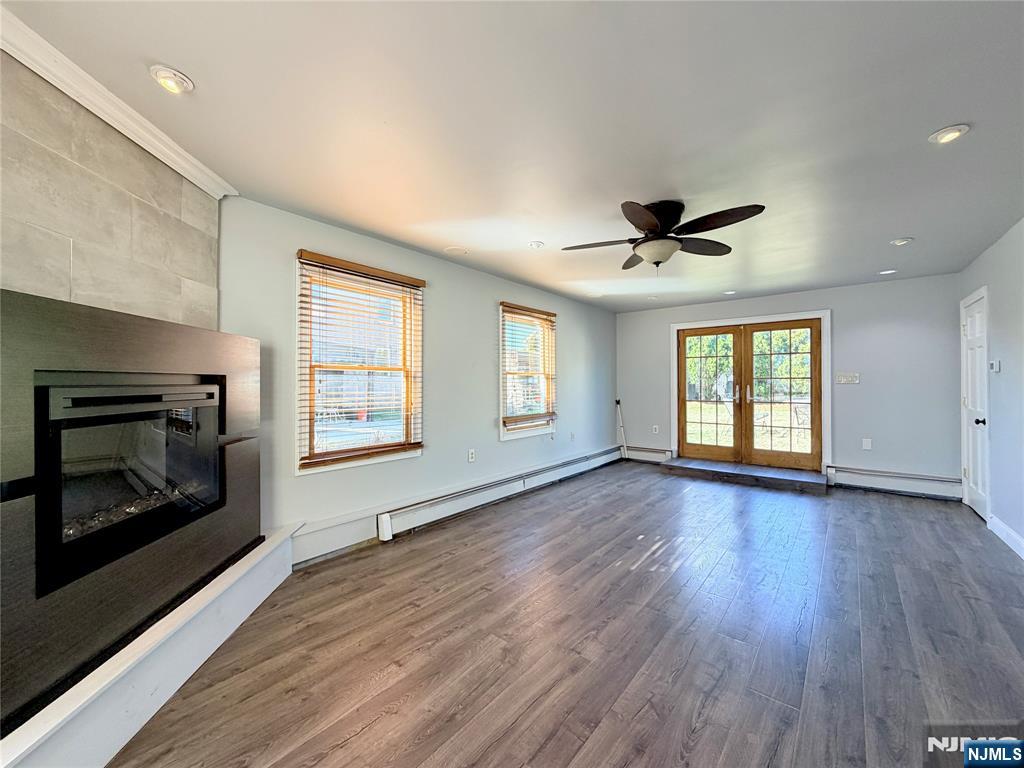 227 Washington Avenue Hackensack, NJ 07601 - Photo 9 of 33 a view of an empty room with a fireplace and a window