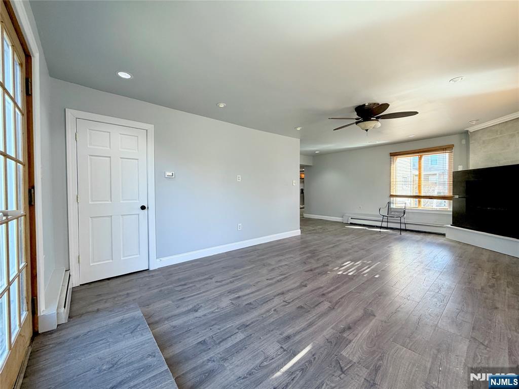227 Washington Avenue Hackensack, NJ 07601 - Photo 10 of 33 wooden floor in an empty room with a window