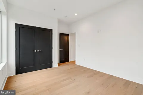a view of a bedroom with closet area