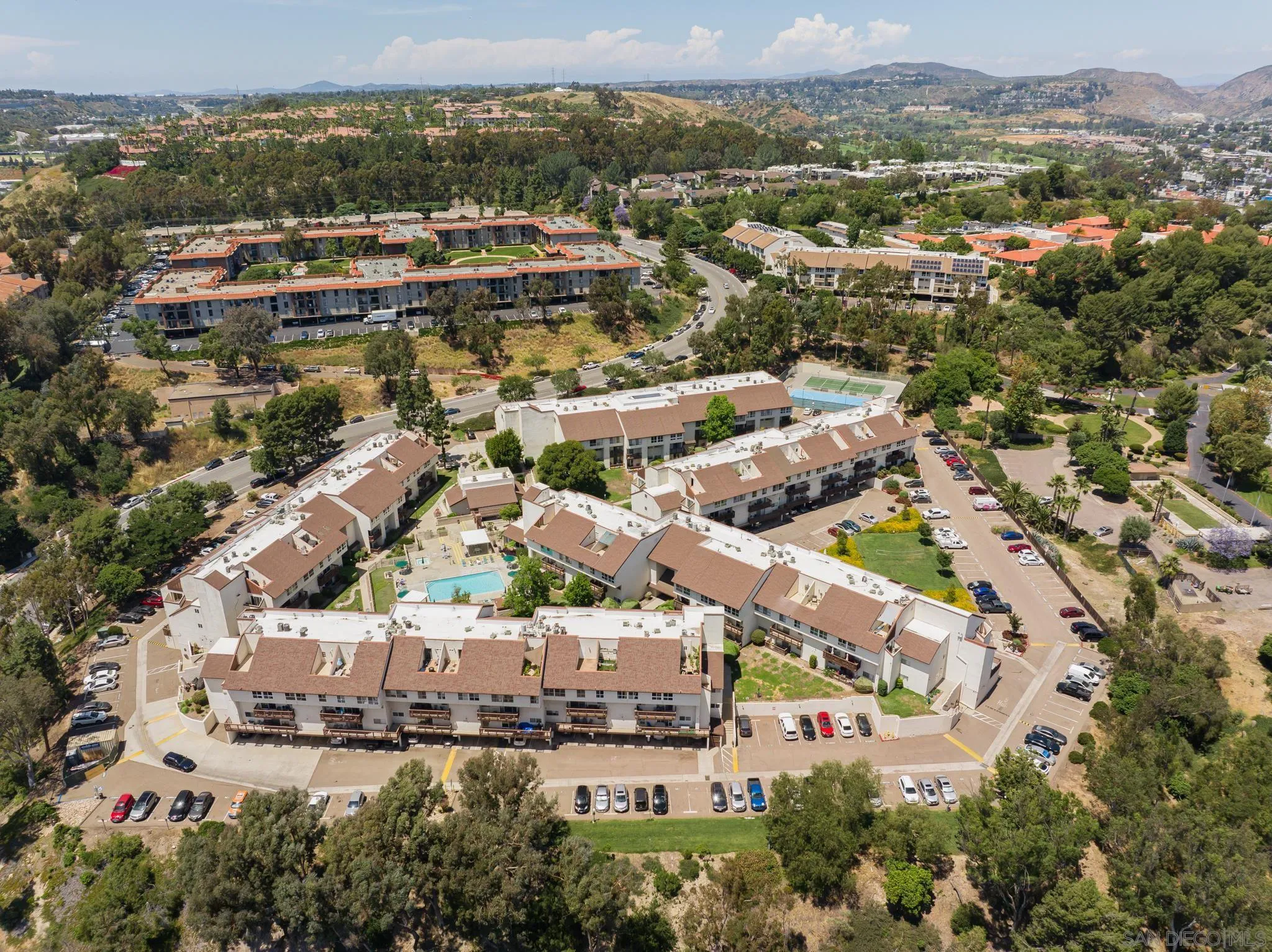 6191 Rancho Mission Road, Unit 309 San Diego, CA 92108 - Photo 29 of 34 an aerial view of residential building with green space
