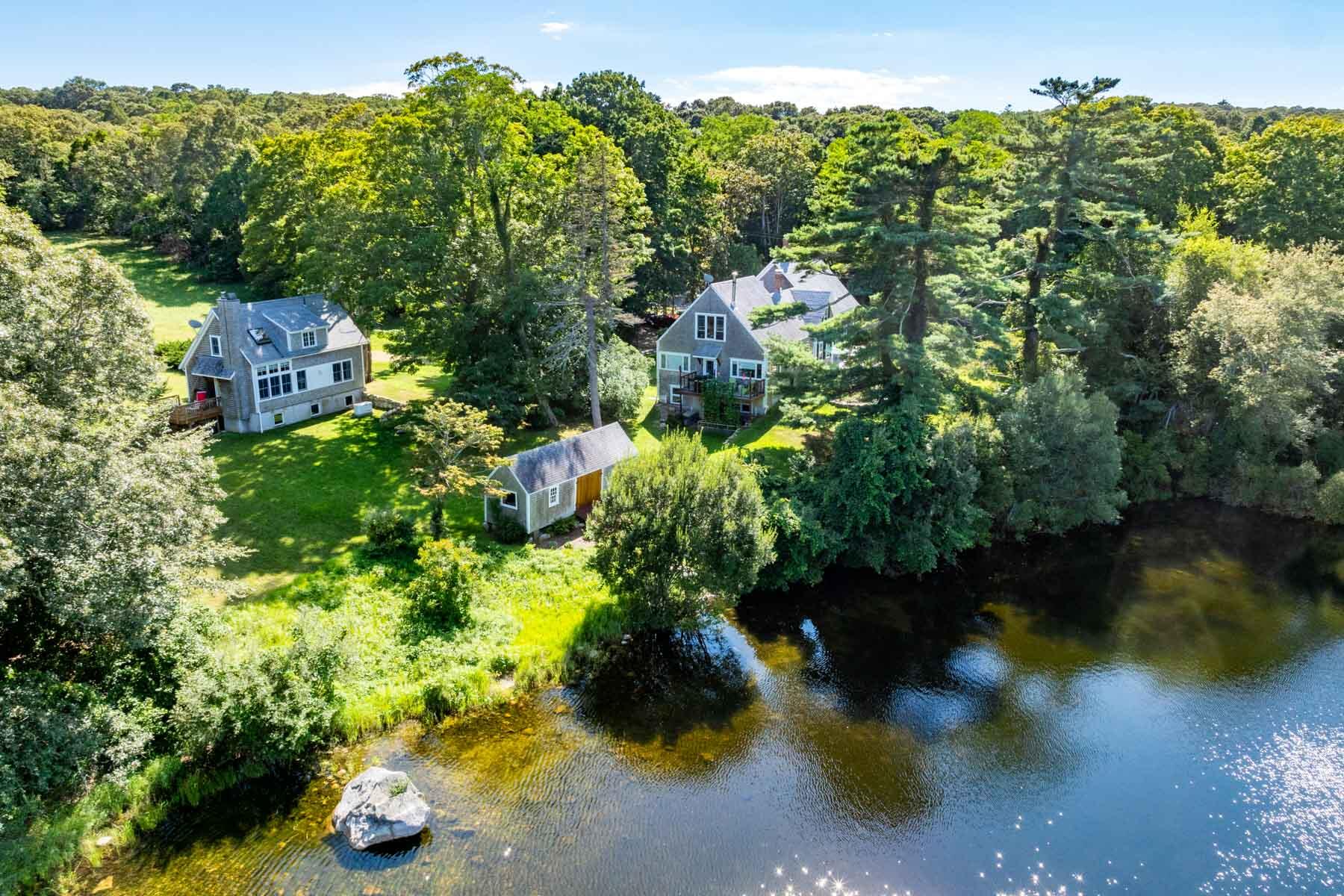 an aerial view of a house with yard swimming pool and outdoor seating