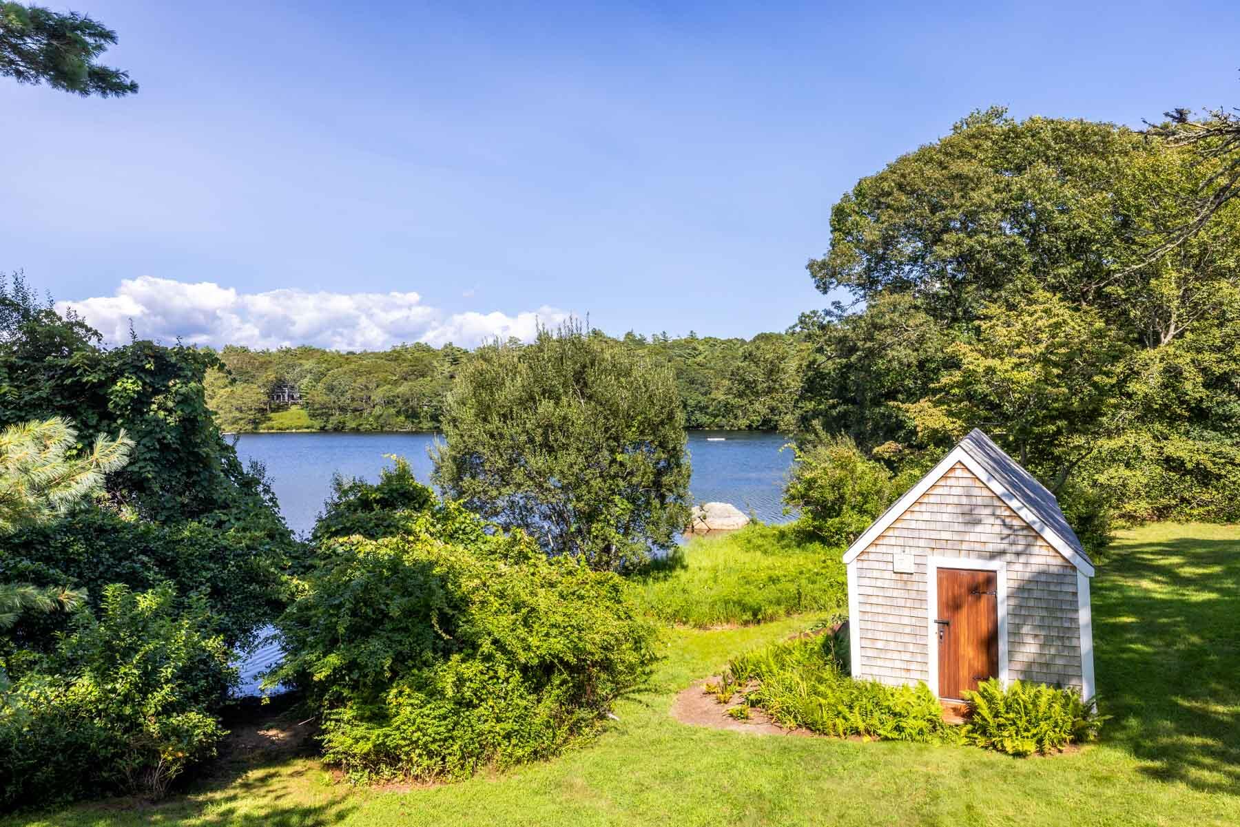 420 Lamberts Cove Road West Tisbury, MA 02568 - Photo 11 of 18 a backyard of a house with lots of green space