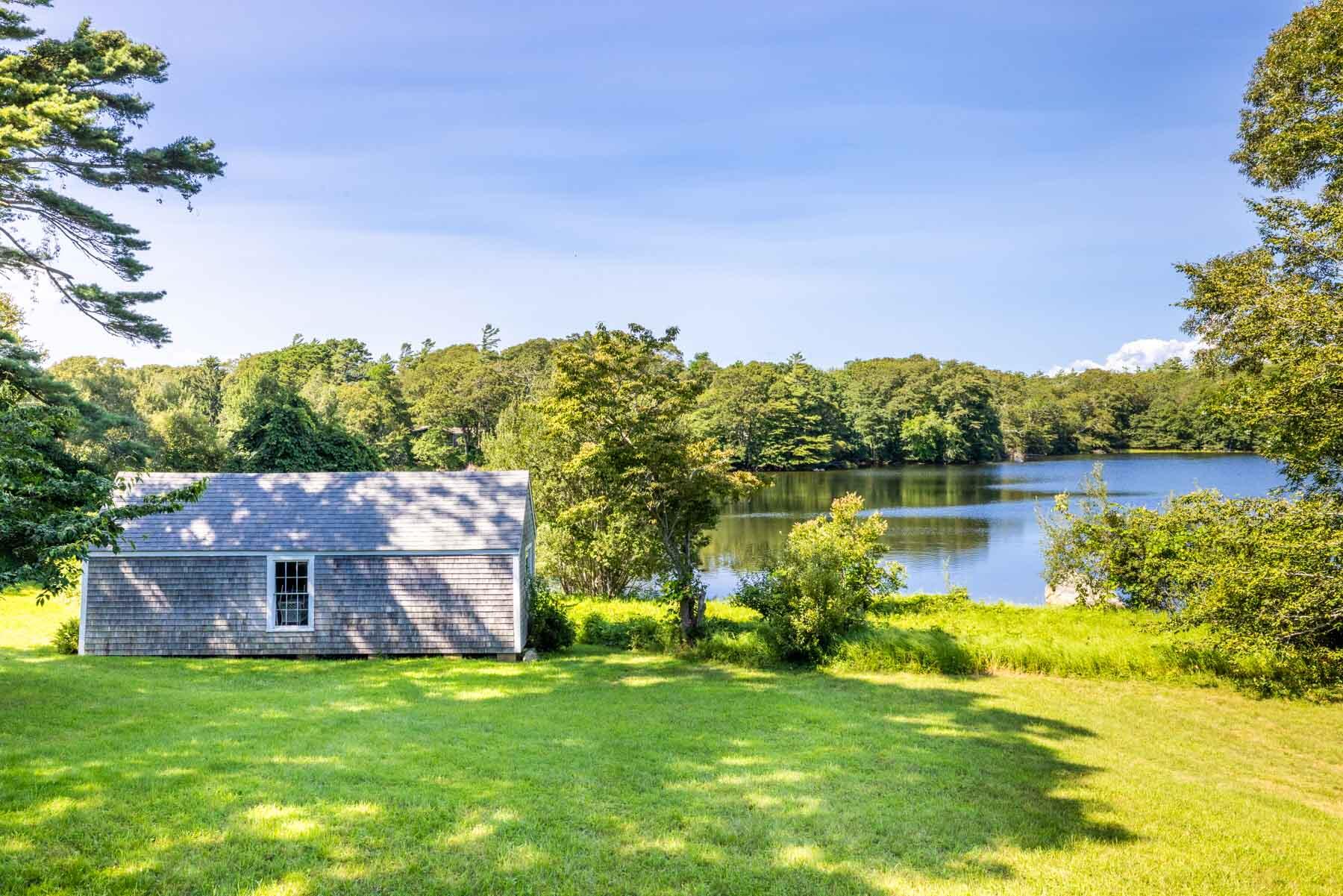 420 Lamberts Cove Road West Tisbury, MA 02568 - Photo 12 of 18 a view of a house with a yard and a fountain