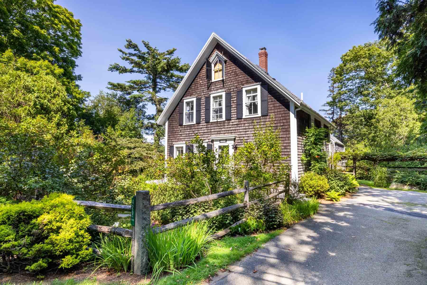 420 Lamberts Cove Road West Tisbury, MA 02568 - Photo 14 of 18 a front view of a house with a yard