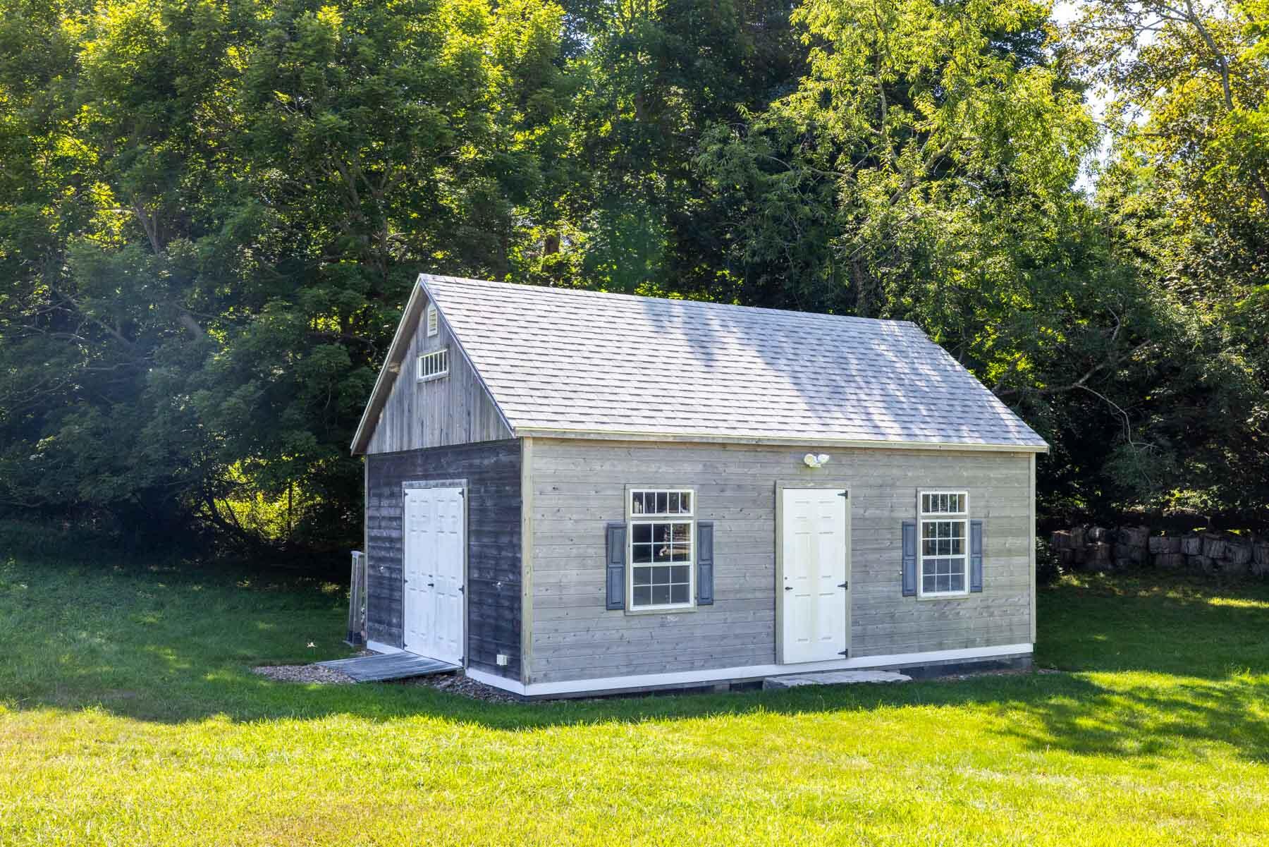 420 Lamberts Cove Road West Tisbury, MA 02568 - Photo 15 of 18 a view of a house with backyard and garden
