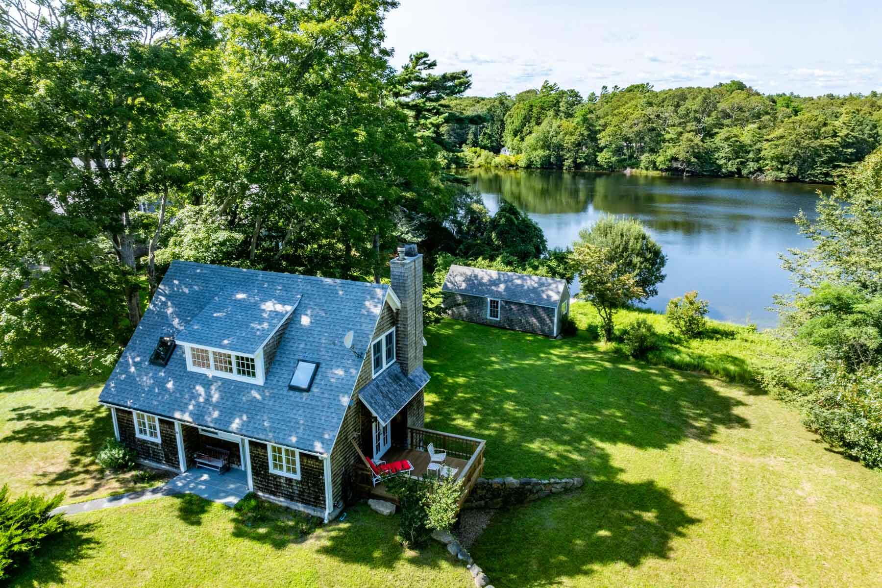 420 Lamberts Cove Road West Tisbury, MA 02568 - Photo 3 of 18 an aerial view of a house with a yard basket ball court and outdoor seating