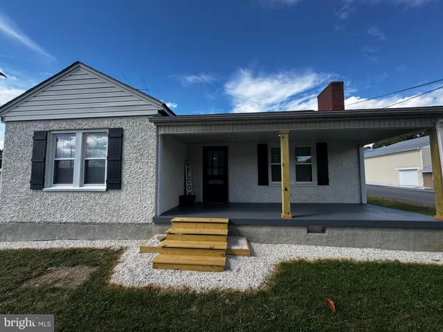 a front view of a house with yard