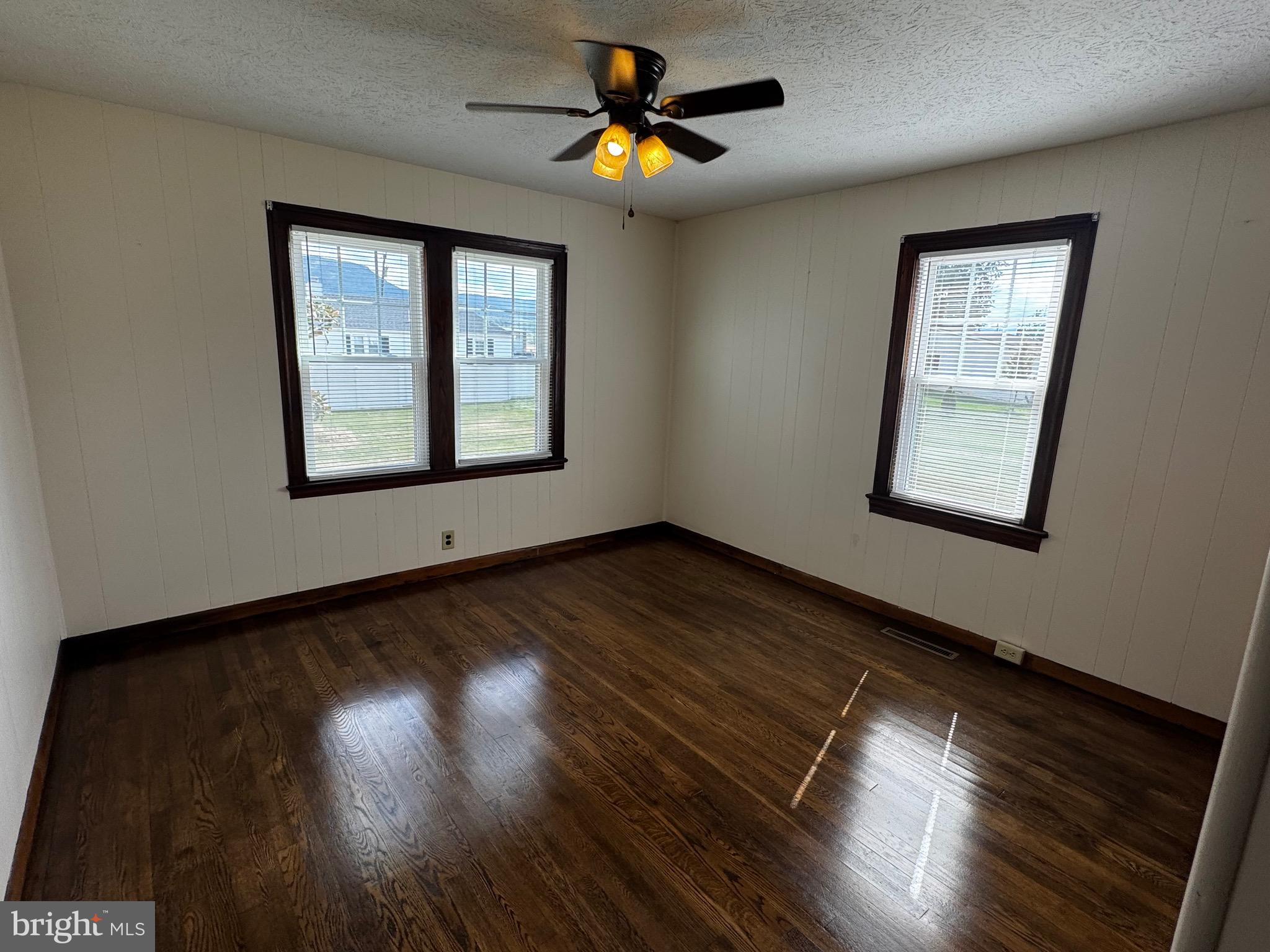 121 Center Street Mount Jackson, VA 22842 - Photo 21 of 46 a view of an empty room with wooden floor and a window