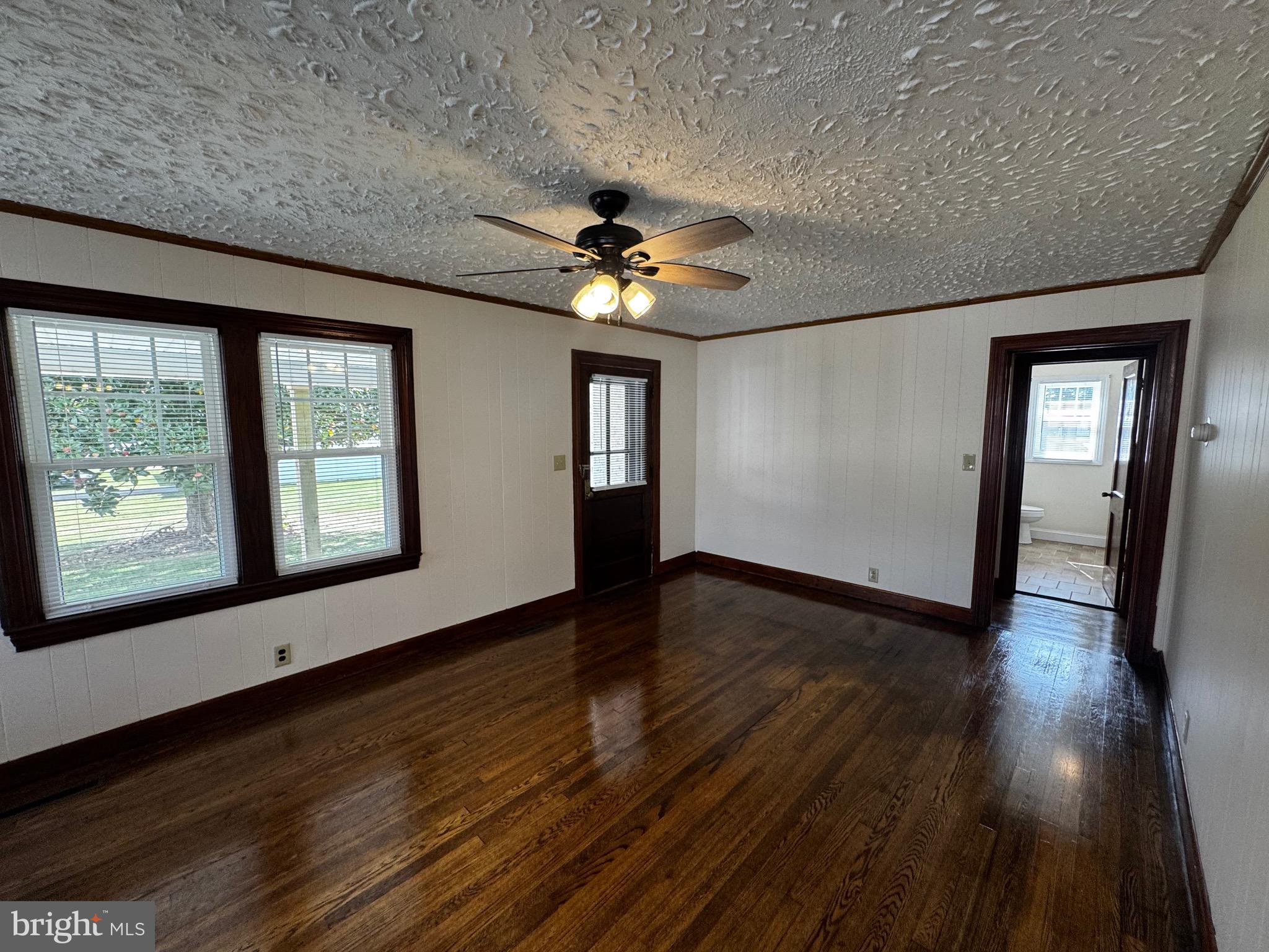 121 Center Street Mount Jackson, VA 22842 - Photo 23 of 46 a view of an empty room with window and wooden floor