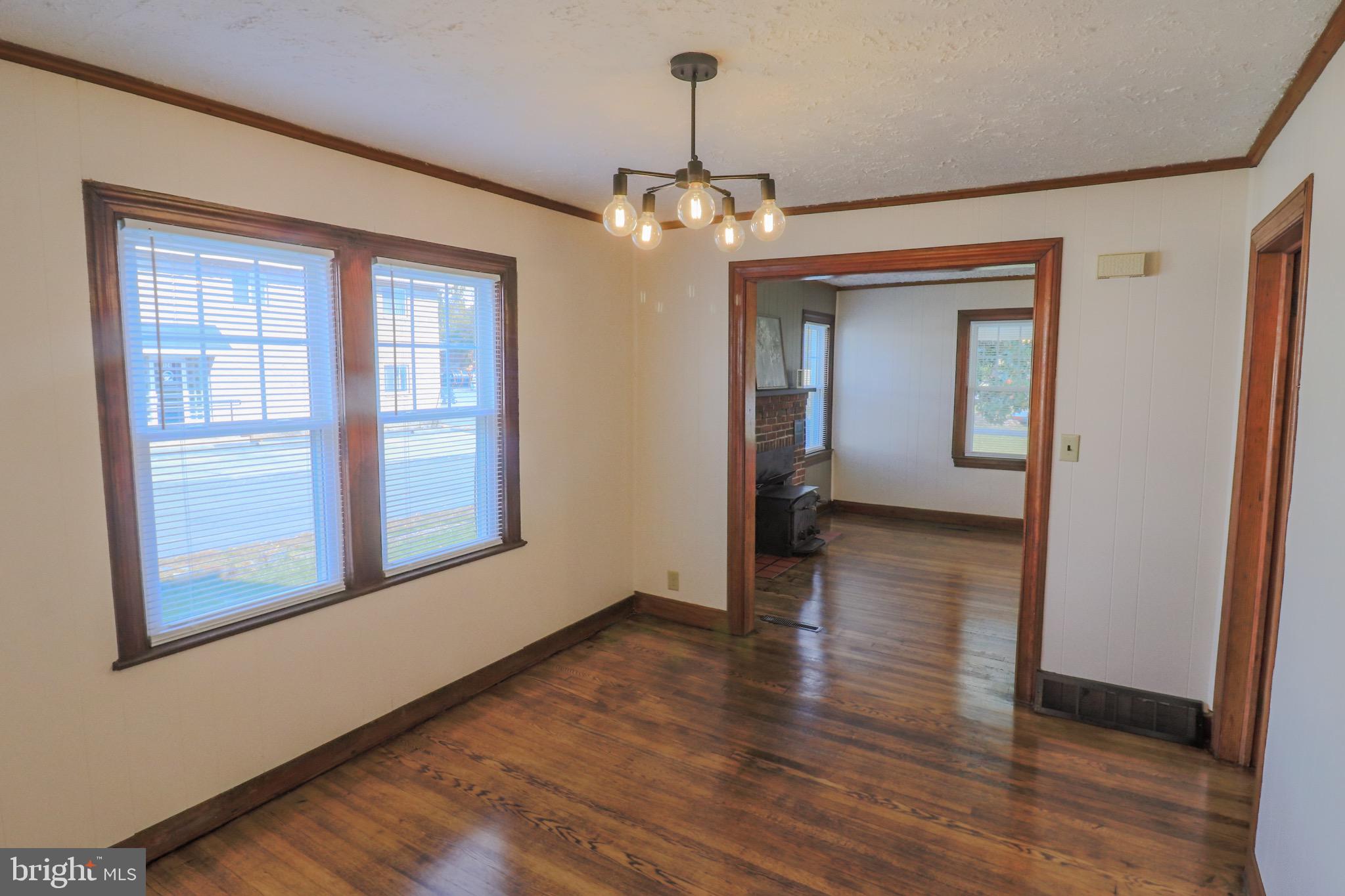 121 Center Street Mount Jackson, VA 22842 - Photo 40 of 46 a view of a room with wooden floor chandelier and windows