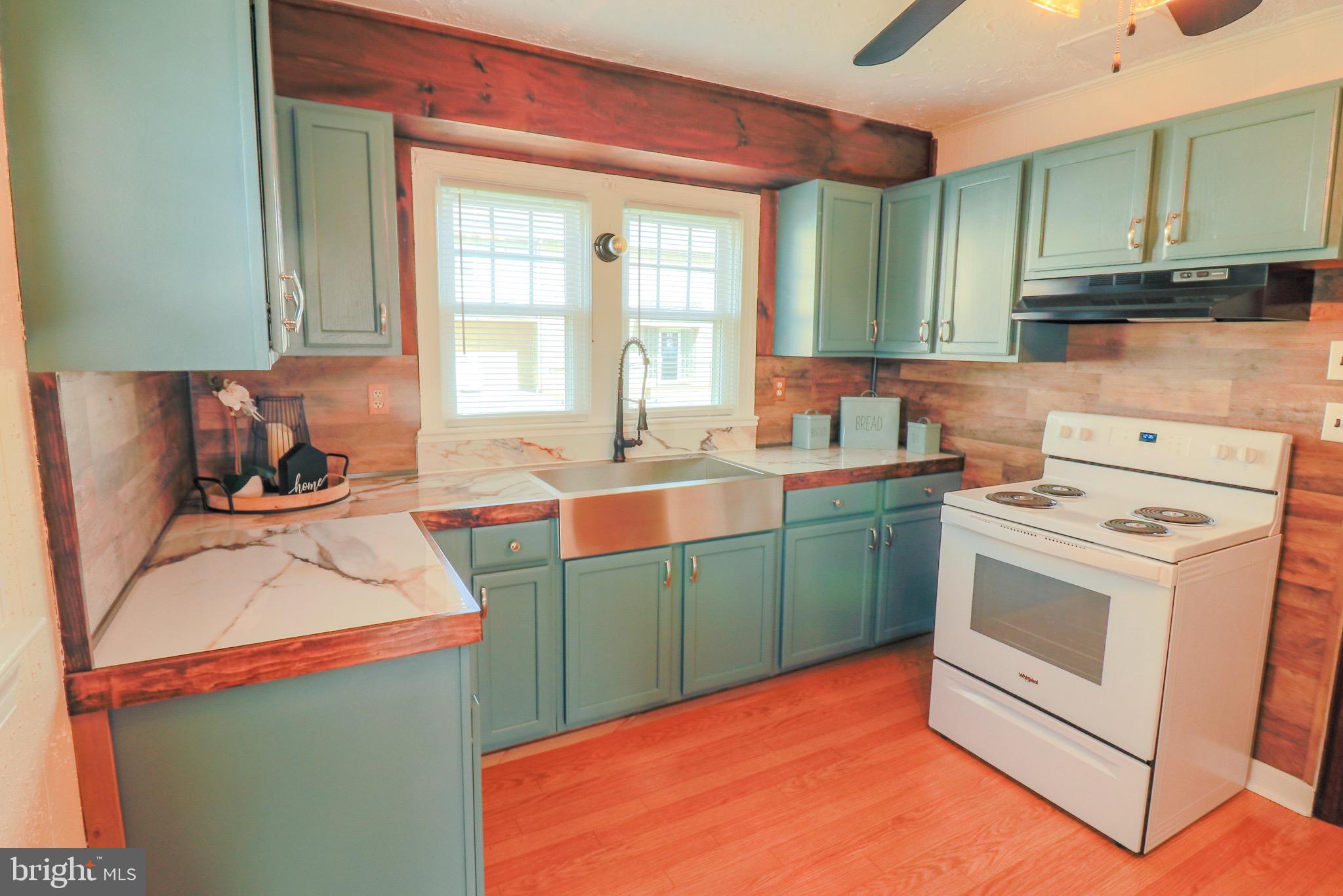 121 Center Street Mount Jackson, VA 22842 - Photo 41 of 46 a kitchen with a sink stove and cabinets
