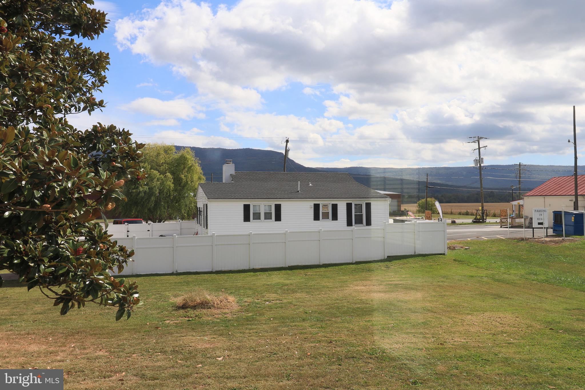 121 Center Street Mount Jackson, VA 22842 - Photo 45 of 46 a view of house with swimming pool and trees in the background