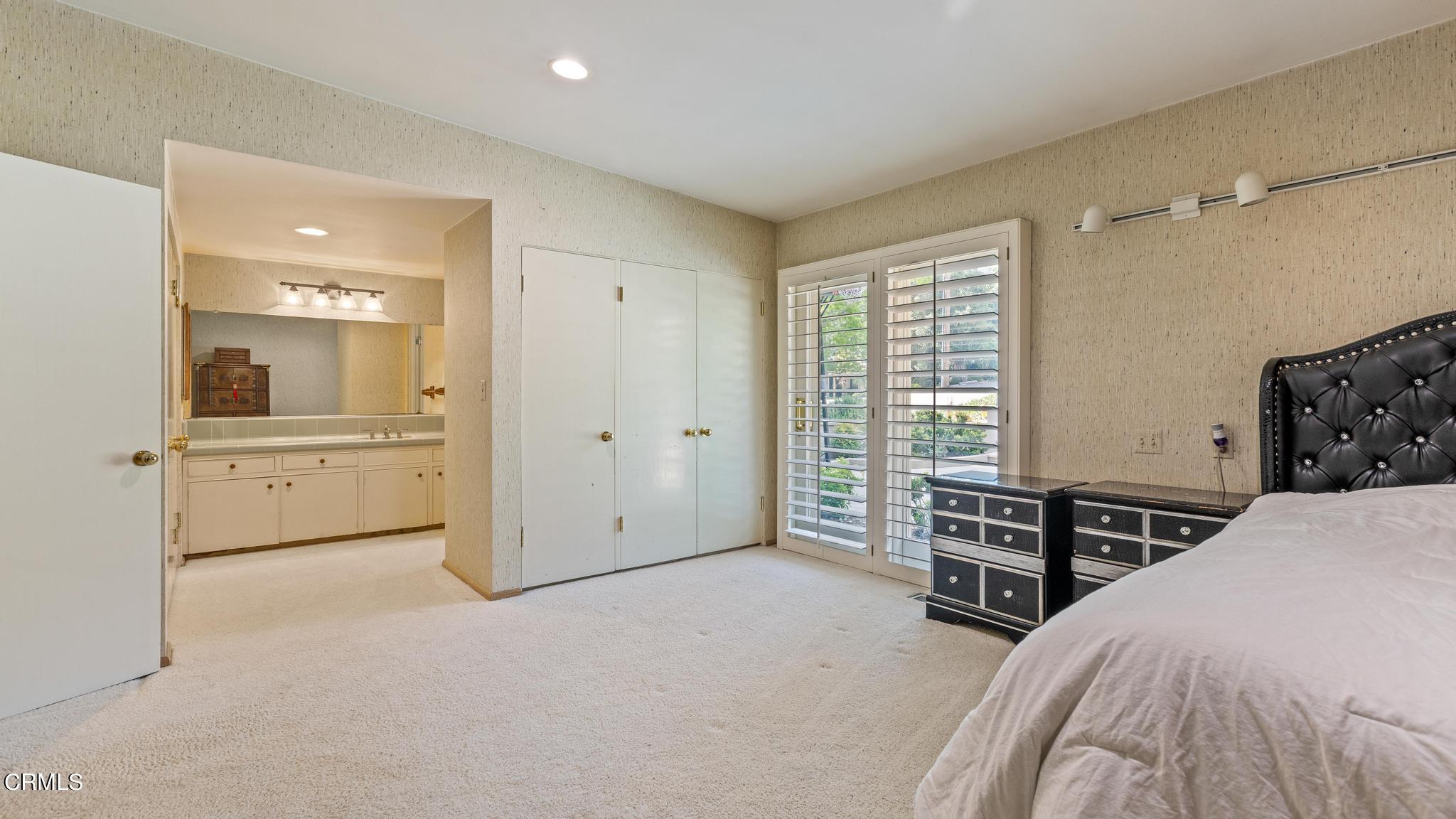 5212 Pizzo Ranch Road La Canada Flintridge, CA 91011 - Photo 22 of 44 a bedroom with a bed and a cabinets