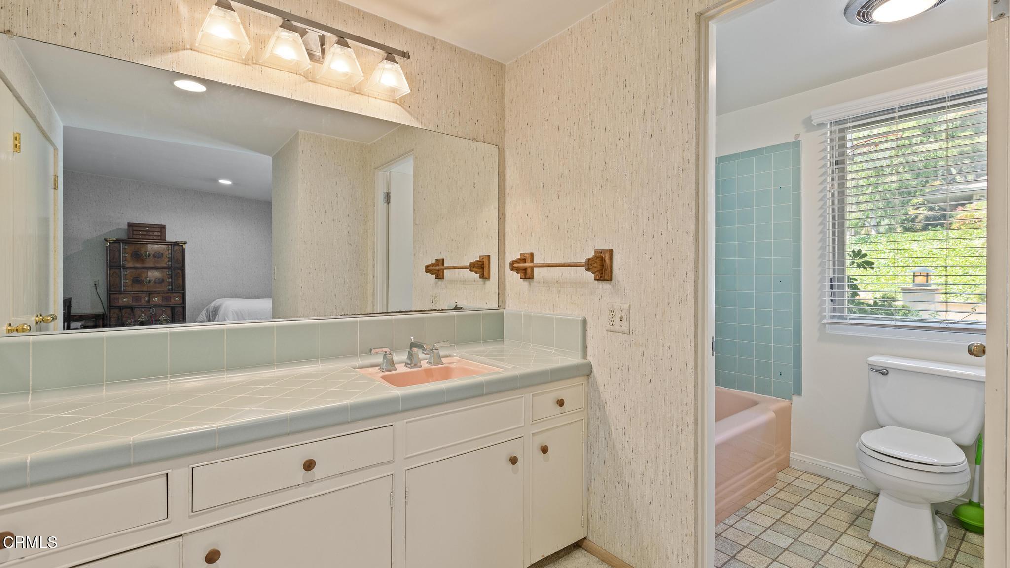 5212 Pizzo Ranch Road La Canada Flintridge, CA 91011 - Photo 23 of 44 a bathroom with a sink a toilet and a mirror