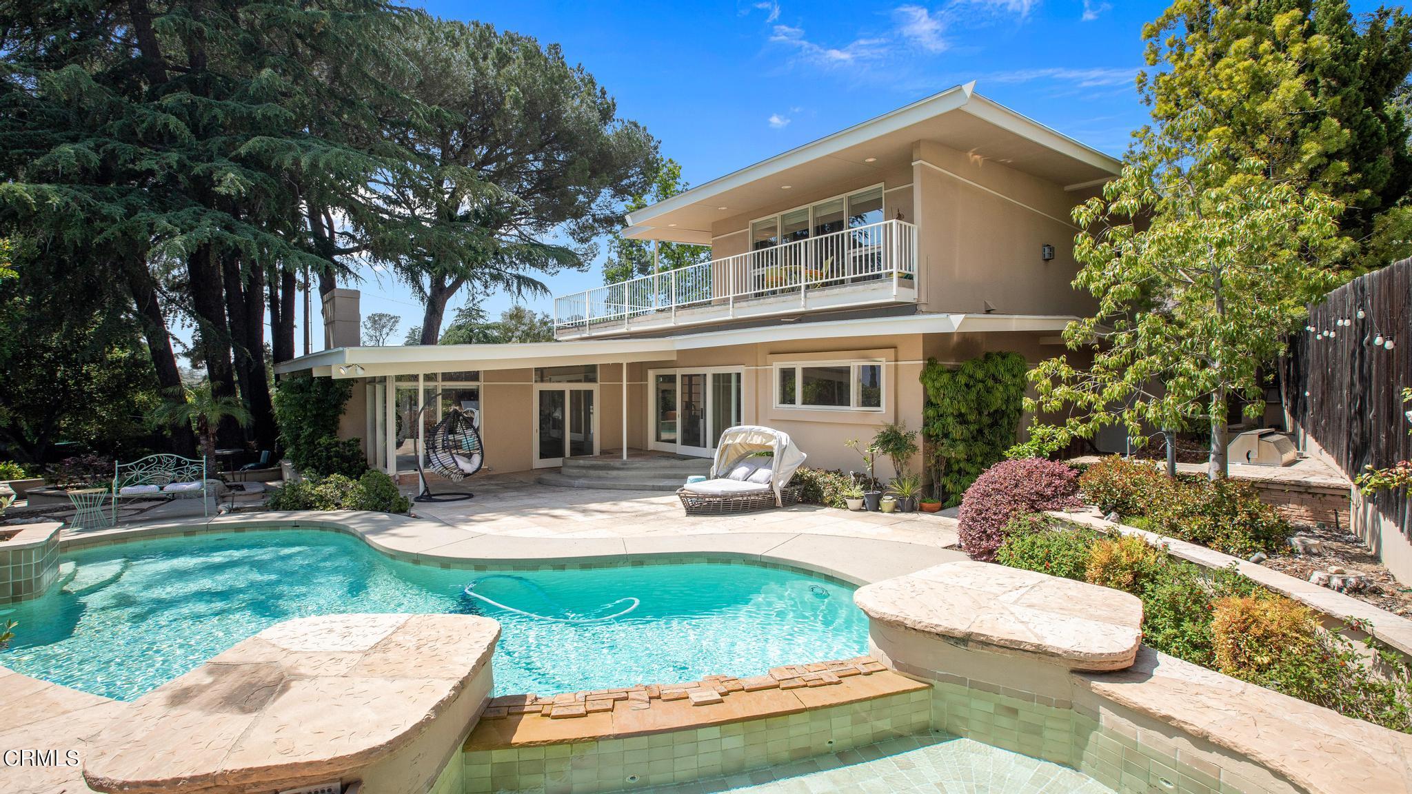 5212 Pizzo Ranch Road La Canada Flintridge, CA 91011 - Photo 33 of 44 a front view of a house with garden and porch